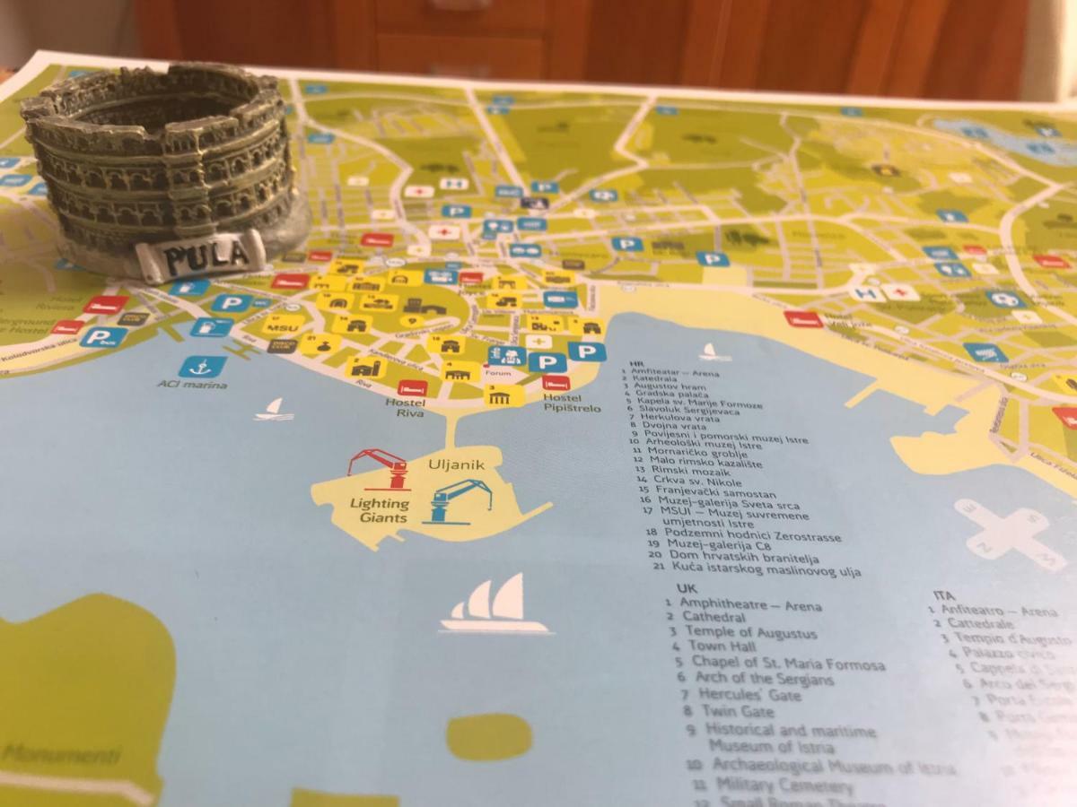 Amu Apartment Pula Bagian luar foto